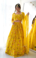 Load image into Gallery viewer, Enticing Yellow Wedding Wear Semi Stitched Georgette Digital Printed Lahengha.

