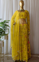Load image into Gallery viewer, Enticing Yellow Wedding Wear Semi Stitched Georgette Digital Printed Lahengha.
